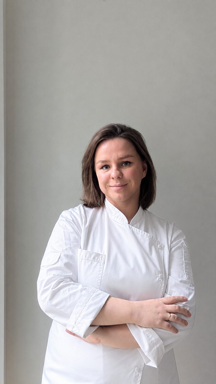 Julia, founder and pastry chef of JP Macarons, in chef's whites